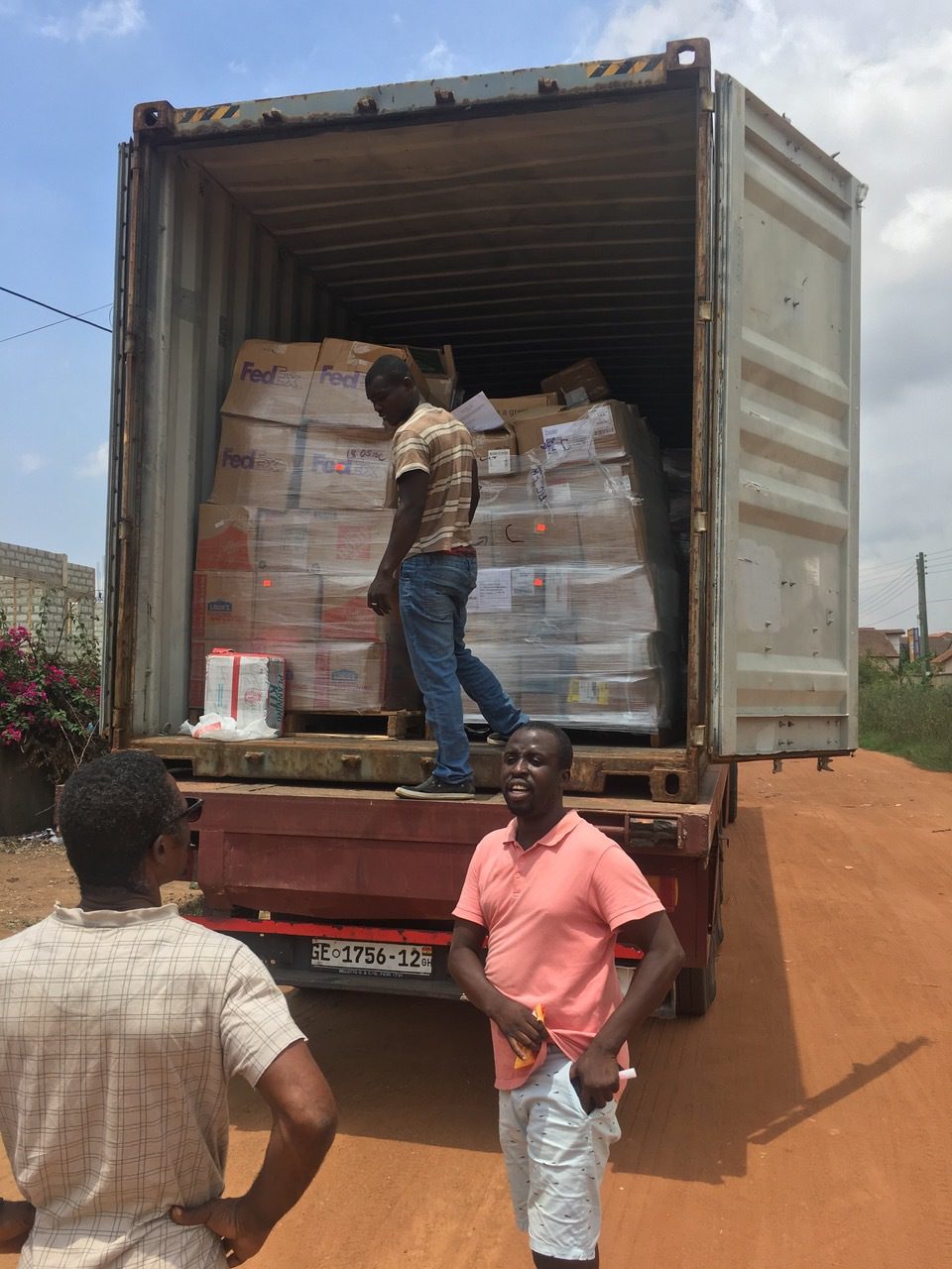 unloading books for the library project in Ghana